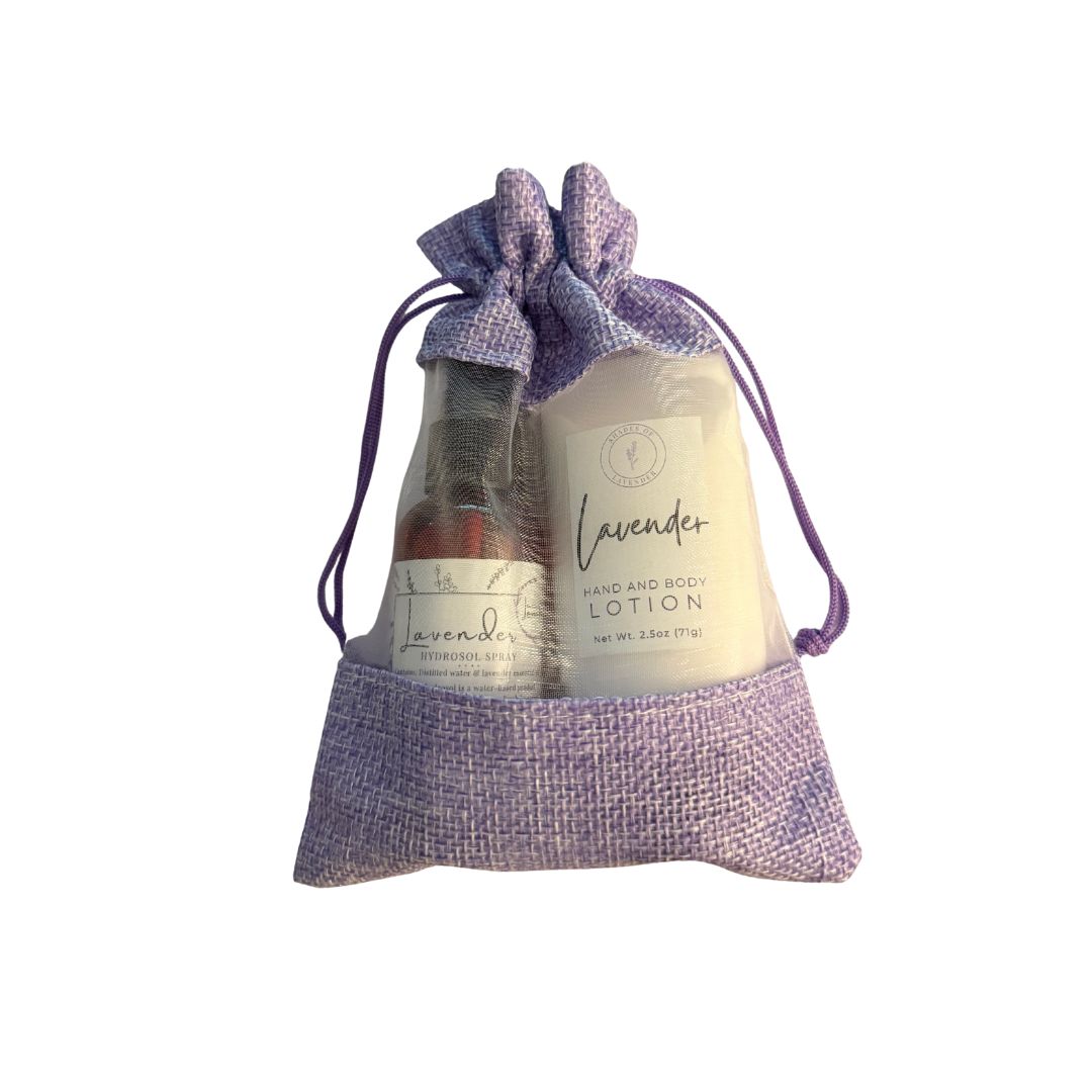 Lavender-themed product set including soap and lotion in a drawstring bag on a white background