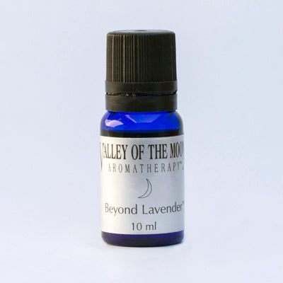 A small blue bottle of essential oil blend -labeled 'Valley of the Moon Aromatherapy' with 'Beyond Lavender' written on it, indicating a volume of 10 ml.