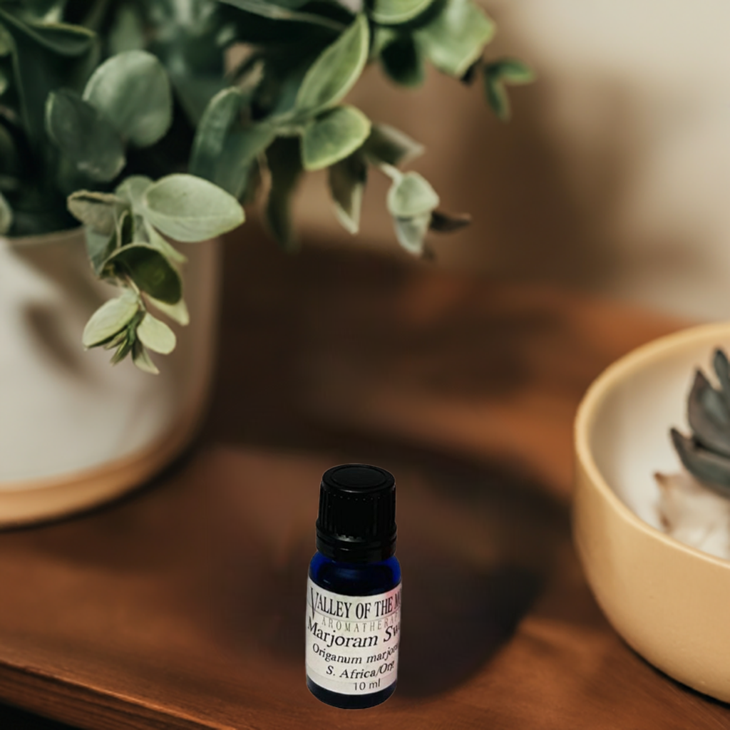 marjoram essential oi blue bottle with valley of the moon aromatherapy label