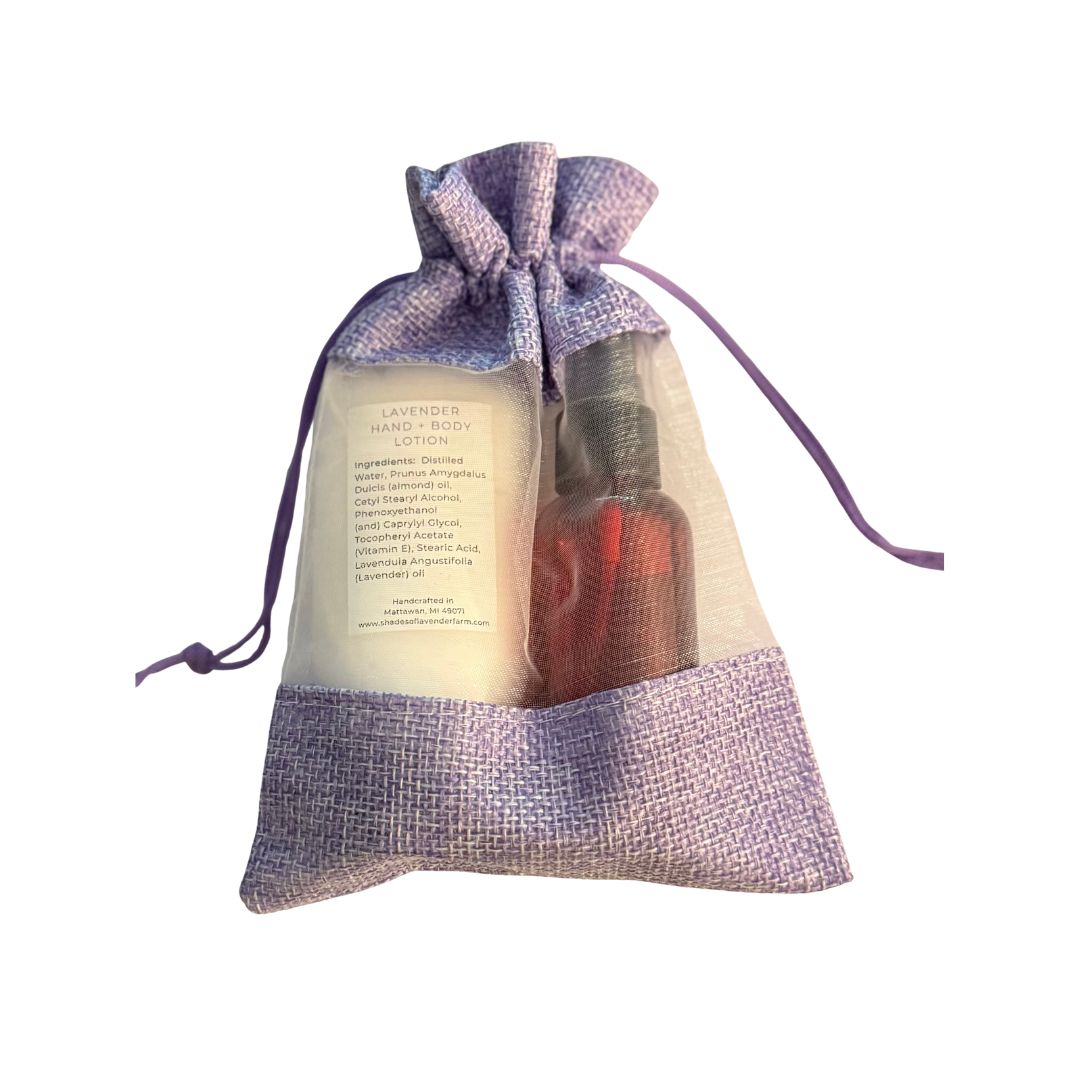 Drawstring bag with lavender-scented hand and body products on a white background